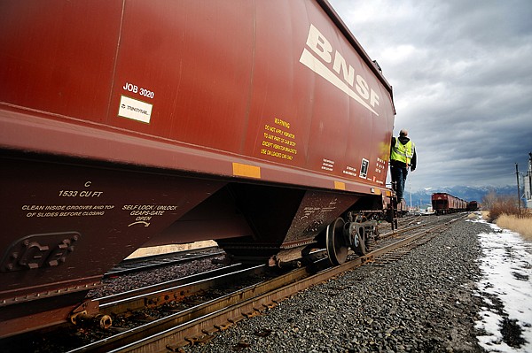 &lt;p&gt;A railroad worker rides on a car running parallel to Center
Street on Tuesday morning in Kalispell.&lt;/p&gt;