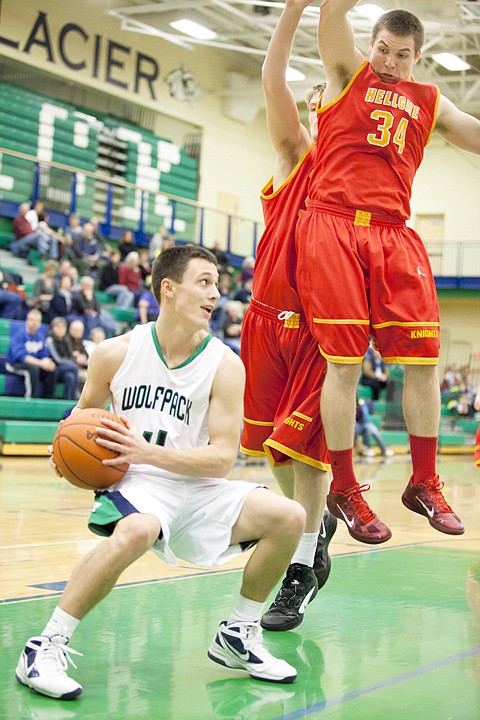 &lt;p&gt;Glacier junior Kyle Griffith (left) pulls the ball down as
Hellgate defenders Zach Peevey (34) and Lucas Wittkopp (center)
react to a shot fake during the Wolfpack's home matchup against
Missoula Hellgate Tuesday night.&lt;/p&gt;