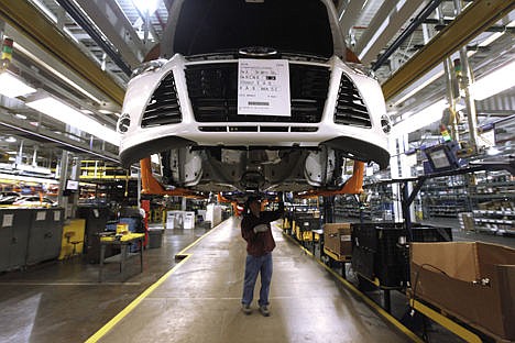 &lt;p&gt;A line worker assembles a 2012 Ford Focus at the Ford Michigan Assembly plant in Wayne, Mich., on Dec. 14, 2011.&#160;&lt;/p&gt;