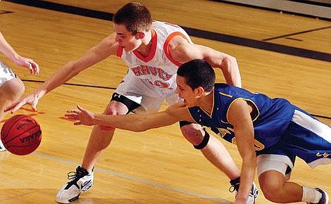 Flathead's Geoff Hogan steals the ball from a Libby player during the third quarter of Flathead's 77-59 victory over the Loggers Tuesday night in Kalispell. Chris Jordan/Daily Inter Lake