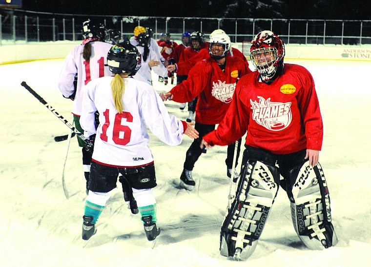 &lt;p&gt;Goalie Bre Zechin smiles as the two teams congratulate each other after the Jan. 30 game. Many of the women have become friends through the league.&lt;/p&gt;