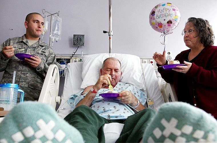 DESPITE the severity of Dave Cochrane&#146;s illness, the family finds opportunities to celebrate the little things. On Friday at Kalispell Regional Medical Center, they enjoy a piece of cake to celebrate Geri's birthday. Their son Jason, left, just returned from serving with the U.S. Air Force in South Korea. Dave has battled a rare form mantle cell lymphoma for six years.