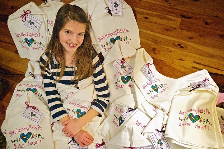 &lt;p&gt;JEROME A. POLLOS/Press What started out as an initial order for 50 dish towels to start off Emily Kladar and her sibling's charity &quot;Kids Helping Kids Fix Broken Hearts&quot; has grown since 2008 with more than 6,000 towels sold and $70,000 raised.&lt;/p&gt;