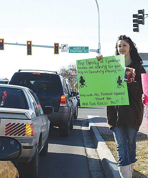 About 15 family members and friends of Guadalupe Sanchez were at
Broadway and Alder Tuesday gathering donations to help offset
funeral costs. Sanchez was fataly shot Saturday in Moses Lake.