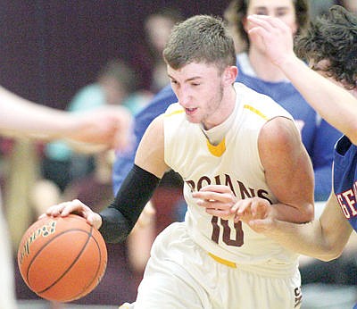 &lt;p&gt;Senior Adam Tallmadge drives through heavy traffic in third quarter vs. Bigfork Friday, Feb. 5.&lt;/p&gt;