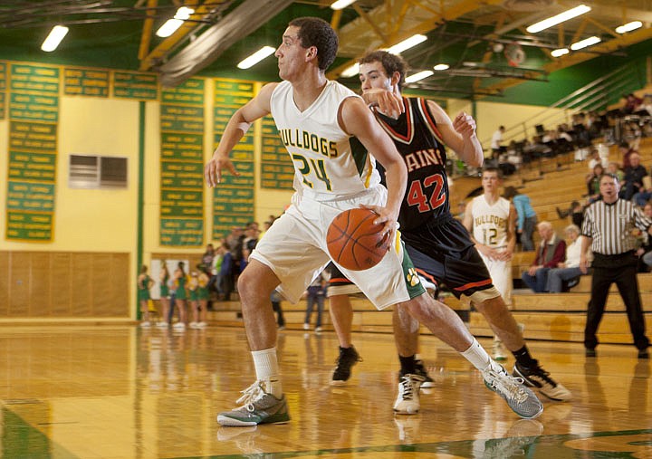 &lt;p&gt;Plains defender Tanner Ostrom (42) tries to keep up with
Whitefish senior Gage Vasquez (24) as he dribbles along the
baseline during the Bulldogs&#146; victory&#160; Thursday night at Whitefish
High School.&lt;/p&gt;