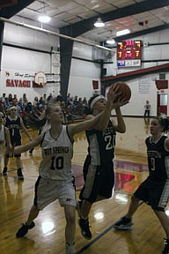 Alberton's Dani Hanley battles Meghan Massingale of Hot Springs for a loose ball during a District 14-C showdown on Saturday. Krysta Henley looks on for the Panthers.