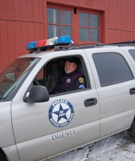 &#151;Photo by KENNY RUNYAN&lt;br&gt;Officer Dave McClelland, 42, sits in his police cruiser outside City Hall, waiting to get back to work, Jan. 30, 2007.