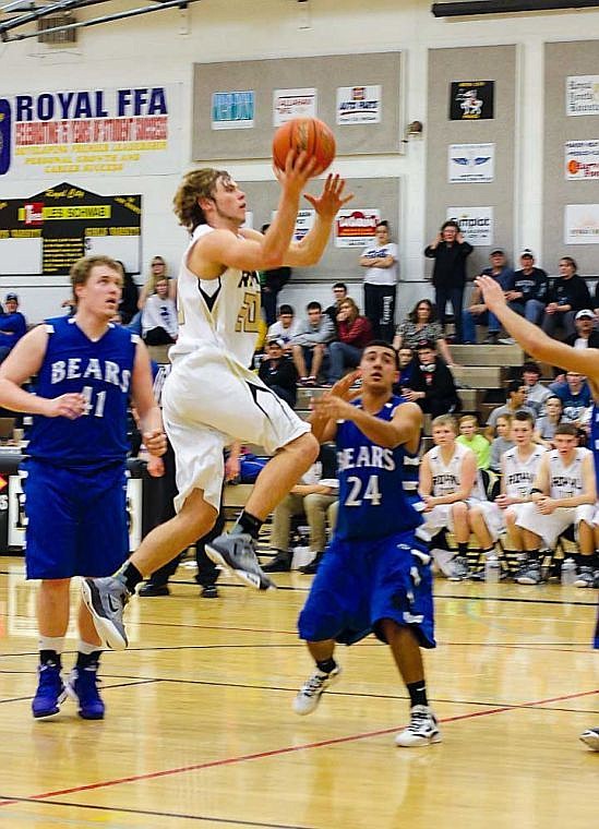 Playing in his final game for the Royal High basketball program, Brady Dixon flies toward the hoop against Kiona-Benton in search of two points.