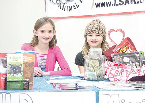 &lt;p&gt;Ronan's Morgan Brooks, left, and her sister Lindsey Brooks take a quick photo break from their duties at the table dedicated to the 4-H dog competition.&lt;/p&gt;