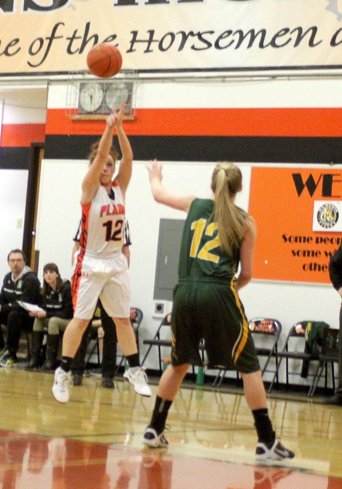 &lt;p&gt;Kassidy Kinzie shoots for the basket over the head of one of the St. Regis Lady Tigers.&lt;/p&gt;