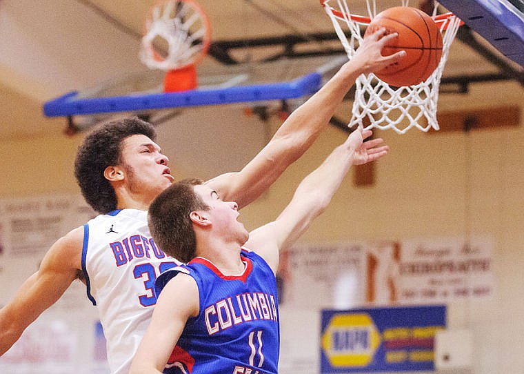 &lt;p&gt;Bigfork senior Christian Evans (left) blocks a layup attempt by Columbia Falls junior guard Trevor Houston Thursday night during the Vikings victory over the Wildcats at Bigfork High School Feb. 6, 2014 in Bigfork, Montana. (Patrick Cote/Daily Inter Lake)&lt;/p&gt;