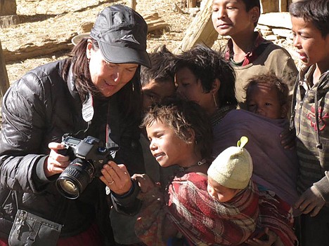 &lt;p&gt;Mary Szymanski of Dalton Gardens shares images on her camera with interested young residents of the remote Nepal village during a trip in November 2012.&lt;/p&gt;