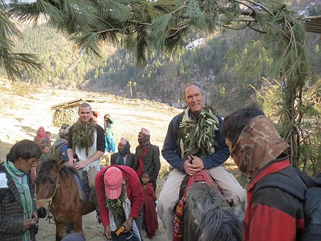 &lt;p&gt;Mike Szymanski, right, of Dalton Gardens, and his son Jake, 25, of New York City, ride into Muri village during their January trip.&lt;/p&gt;