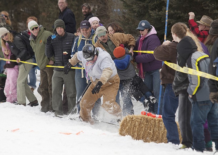 &lt;p&gt;A participant in the 34th Annual Barstool Ski Races makes his
way into the crowd as he loses control of his sled at Cabin Fever
Days in Martin City Saturday afternoon..&lt;/p&gt;