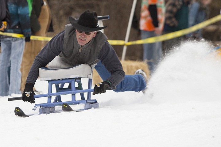 &lt;p&gt;Vernon Kiser drags a foot to try to steer his ride in the 34th Annual Barstool Ski Races at Cabin Fever Days in Martin City.&lt;/p&gt;