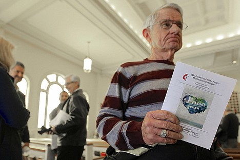 &lt;p&gt;Ron McKenzie holds a prayer program titled &quot;Love Conquers Fear&quot; following a Feb. 6 service at the First United Methodist Church in Fremont, Neb. The service was held ahead of a special election on Tuesday, Feb. 11, to decide whether to drop housing restrictions against illegal immigrants, as had been approved by Fremont voters in the 2010 elections.&lt;/p&gt;