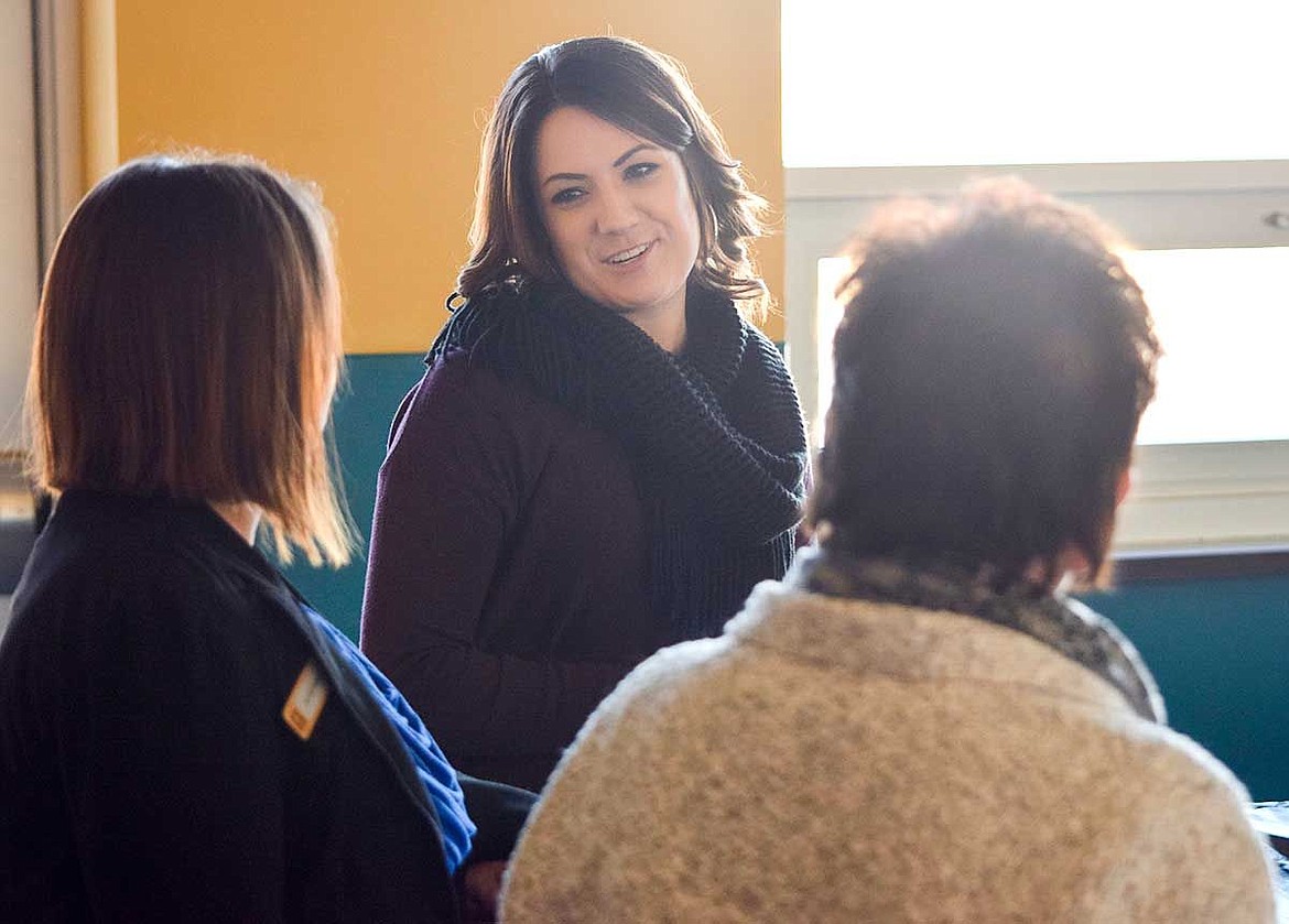 Rachelle Beresford (center), of the Boys and Girls Club, speaks with Umpqua Bank representatives Jennifer Shipman (left), Juliann Dodds (right) and Vaughn Jordan (not pictured) during a tour of the clubhouse Tuesday.