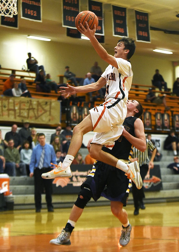 &lt;p&gt;Flathead's Matt Marshall soars past Missoula Sentinel's Mitch Reynolds to score a basket after a steal in the final minute of the second quarter at Flathead on Thursday. (Aaric Bryan/Daily Inter Lake)&lt;/p&gt;