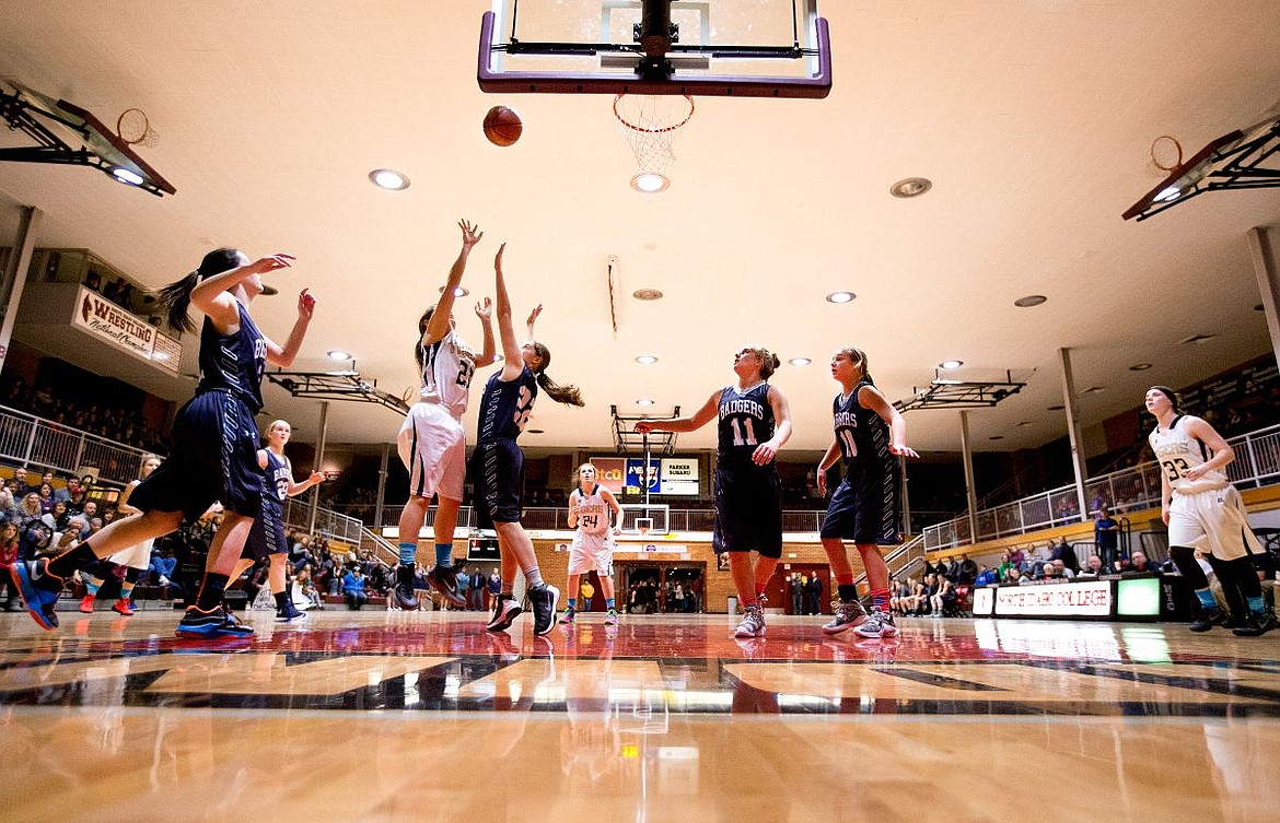 &lt;p&gt;JAKE PARRISH/Press Timblerlake's Erica Powell shoots past Natasha Webster of Bonners Ferry during the 3A District 1 championship game on Wednesday at North Idaho College.&lt;/p&gt;