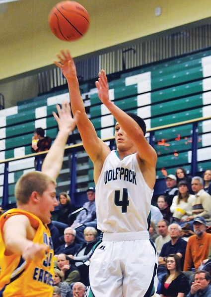 Glacier's Kyle Griffith lifts a shot of Missoula Big Sky's Matt Ethridge in the second half. Griffith scored a career high 17 points.