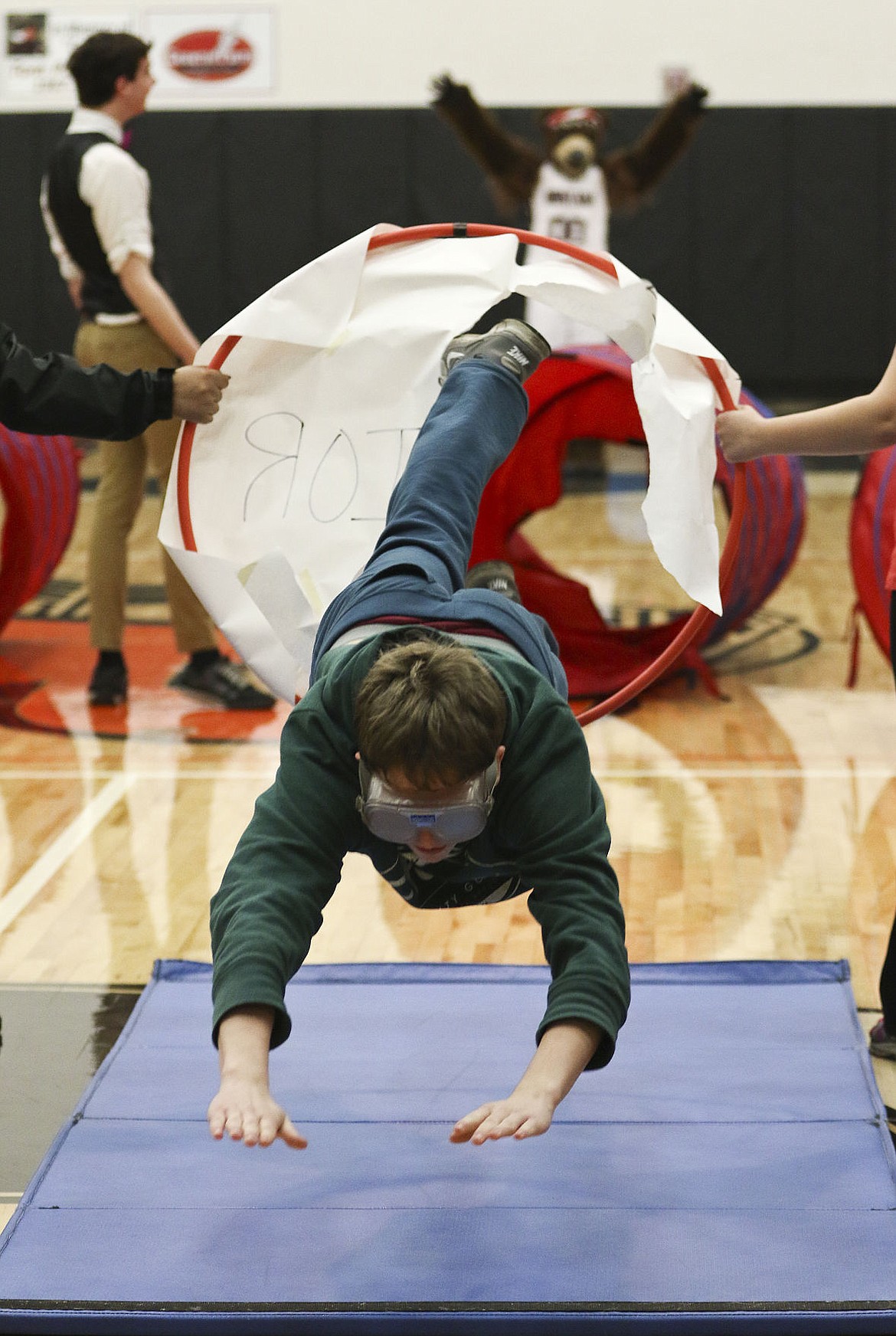 &lt;p&gt;A Ronan student dives through a hoop during the pep assembly last week.&lt;/p&gt;