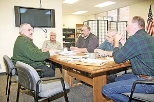 <p>Lincoln County Librarian Rick Ball discusses a possible library move to the old Asa Wood School. Looking on from left are Administrator Bill Bischoff and commissioners Tony Berget, Ron Downey and Mike Cole.</p>