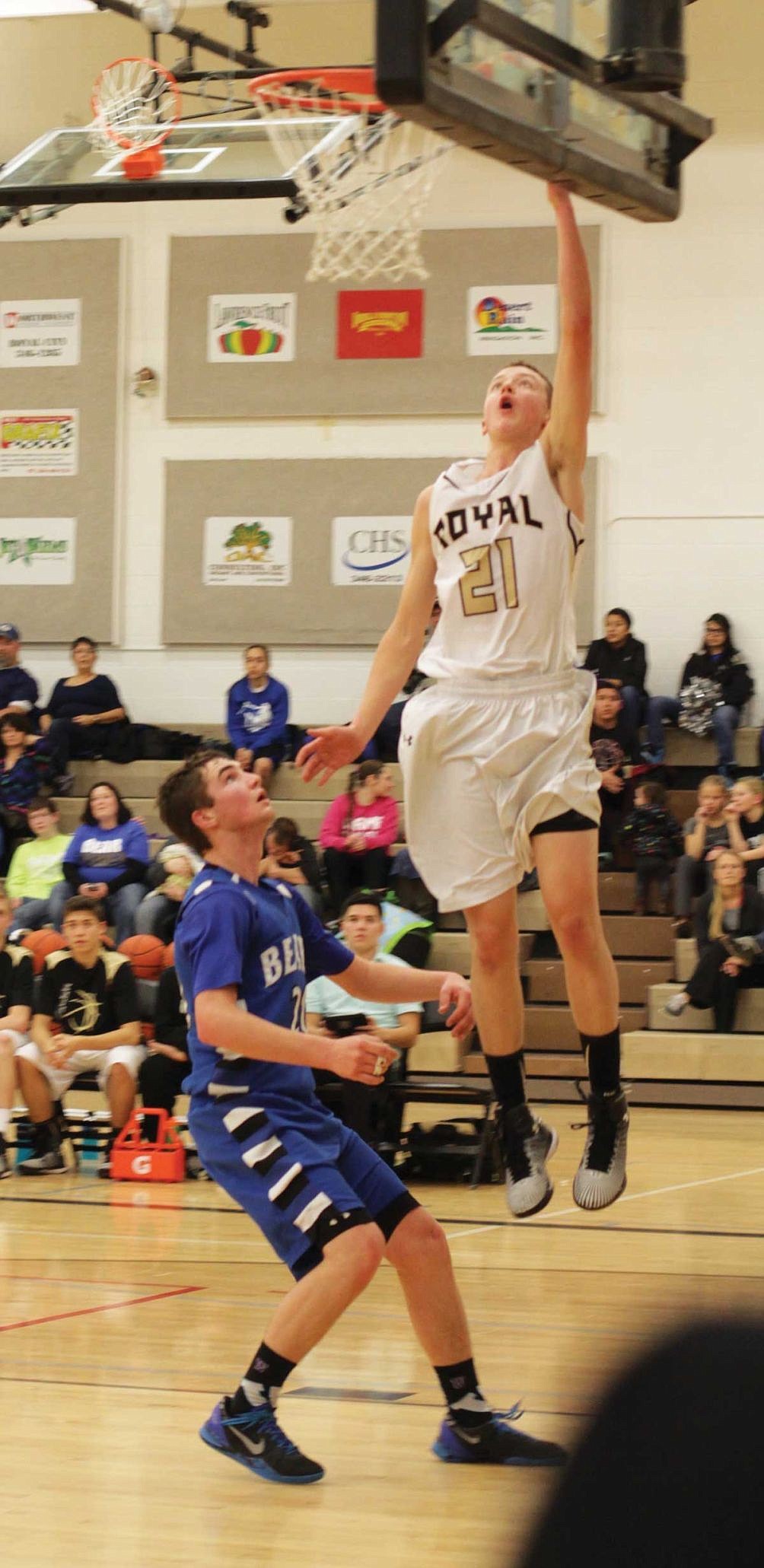 Riley Lefler of Royal lays in two of his nine points.