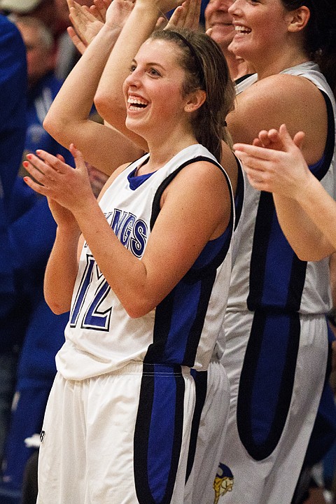 <p>Kyeli Parker celebrates following Coeur d'Alene High School's victory over Lake City for a state playoff berth.</p>