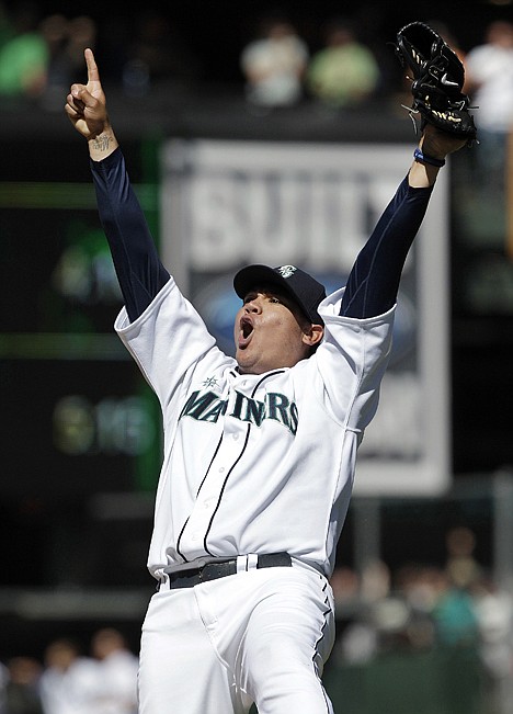 &lt;p&gt;Seattle Mariners pitcher Felix Hernandez reacts after throwing a perfect game against the Tampa Bay Rays in Seattle on Aug. 15, 2012. Hernandez and the Mariners are working on a $175 million, seven-year contract that would make him the highest-paid pitcher in baseball.&lt;/p&gt;