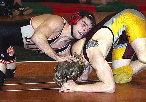 Eureka's Gatlin Paine counters a shot by Daniel Madel of Choteau at the All-Class State Wrestling Tournament Saturday. Paine decisioned Madel 7-2 to finish third in Class B-C at 145 pounds. Mike Richeson/Daily Inter Lake