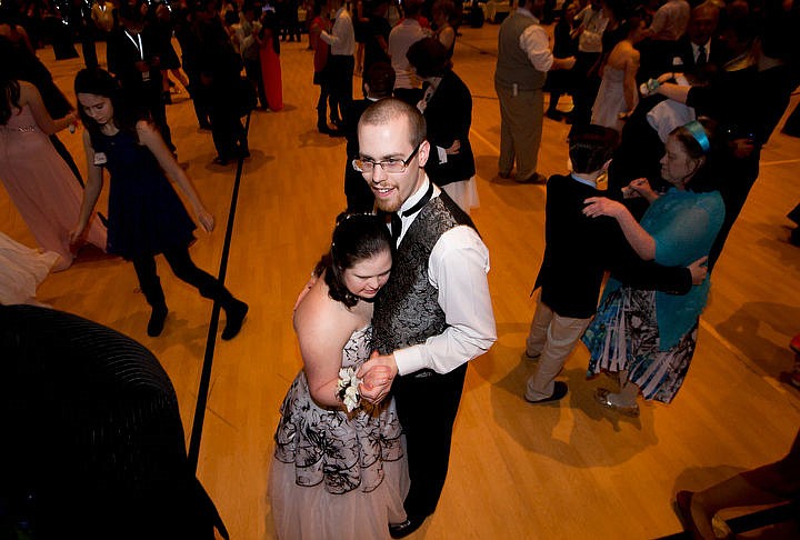 &lt;p&gt;Trevor Kirsebom pulls his girlfriend and prom date Nikki Cotter in close as they slow dance at the Night to Shine prom on Friday at Real Life Ministries in Post Falls. Sponsored by the Tim Tebow Foundation, Night to Shine prom is an annual dance for people with physical and mental disabilities, and is held in hundreds of locations throughout the county.&lt;/p&gt;