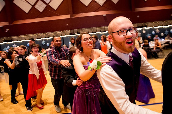 &lt;p&gt;Steven Kirsebom and his prom date Abbey Waterdown take part in a giant &quot;train&quot; at the Night to Shine prom on Friday, Feb. 12, 2016 at Real Life Ministries in Post Falls. Sponsored by the Tim Tebow Foundation, Night to Shine prom is an annual dance for people with physical and mental disabilities, and is held in hundreds of locations throughout the county.&lt;/p&gt;