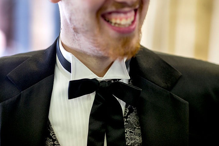 &lt;p&gt;Wearing a country-Western-style tuxedo, Trevor Kirsebom smiles as he checks himself out in the mirror on Friday, Feb. 5, 2016 at Touchdown Tuxedo in Post Falls. &quot;I want to try something different this year,&quot; Kirsebom says. &quot;I think my girlfriend [Nikki] will like this a lot.&quot;&lt;/p&gt;