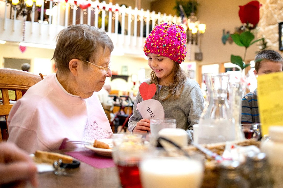 &lt;p&gt;Noah's Ark Learning Center kindergartner Aspen Wood gives Jean Rey a handmade Valentine card on Thursday afternoon at Bestland Retirement Apartments in Coeur d'Alene. Eleven kindergartners passed out more than 80 cards to Bestland residents.&lt;/p&gt;