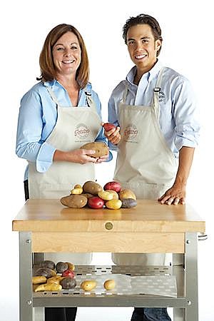 Courtesy photo<br> Washington State Potato Commissioner Angela Pixton, left, stands with skater Apolo Ohno, right, during a photo shoot.