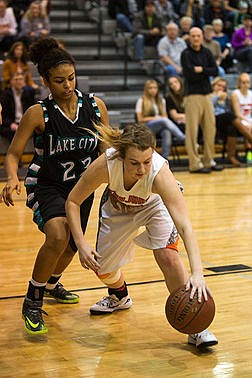 &lt;p&gt;Post Falls&#146;s Madie King steals a dropped ball from Lake City&#146;s Whitney Meier during the first half of the 5A Region 1 Tournament on Thursday night. Post Falls beat Lake City 52-35.&lt;/p&gt;