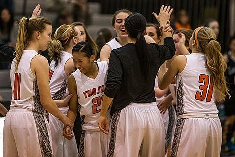 &lt;p&gt;The Post Falls Trojans celebrate a ten point lead against Lake City after the end of the third quarter. Post Falls beat Lake City 52-35 in the 5A Region 1 Tournament on Thursday night.&lt;/p&gt;