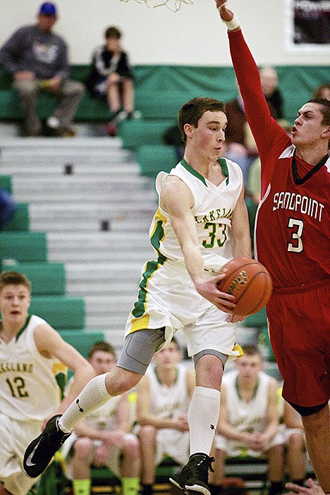 &lt;p&gt;Randy McCabe from Lakeland High makes a pass while in midair around Sandpoint High's Chase Rodriguez.&lt;/p&gt;