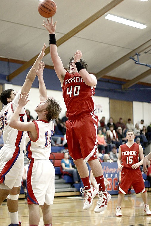 <p>Red Devil Oliver Grupenhoff makes a shot in the game against Superior.</p>