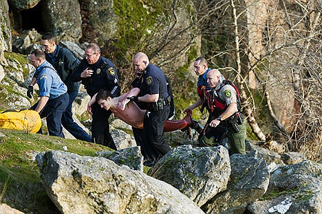 &lt;p&gt;Crews with the Coeur d&#146;Alene Police Department, Kootenai County Sheriff&#146;s Office and Coeur d&#146;Alene Fire Department, carry a man, believed by authorities to be about 20-years-old, to a gurney after coaxing him out of the frigid waters of Lake Coeur d&#146;Alene Thursday near the Third Street boat launch. Officers responded to a disturbance call and found the man in chest-deep water who had been in the lake for about two hours.&lt;/p&gt;