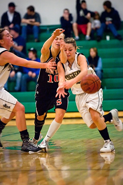 &lt;p&gt;Timberlake High's Kara Wenstrom, right, is fouled by Tristan Troudt of Priest River while going for a loose ball Friday in the fourth quarter of the girls 3A District 1-2 championship game in Rathdrum.&lt;/p&gt;