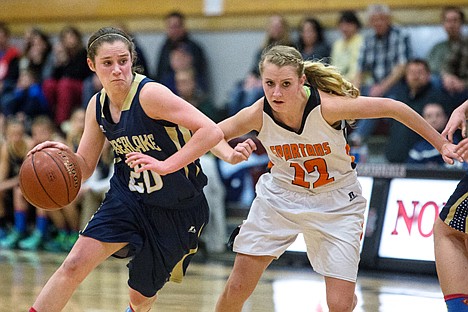 &lt;p&gt;Allison Kirby works her way around Priest River&#146;s Angel Clark Wednesday during the 5A region 1 tournament.&lt;/p&gt;