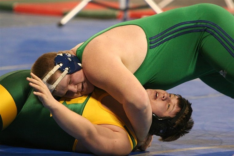 Glacier&#146;s Dan Gilbert pins CMR&#146;s Cameron Farrell during an early round at heavyweight. Gilbert won both of his matches on Friday and will face Flathead&#146;s Connor Thomas in today&#146;s semifinal.