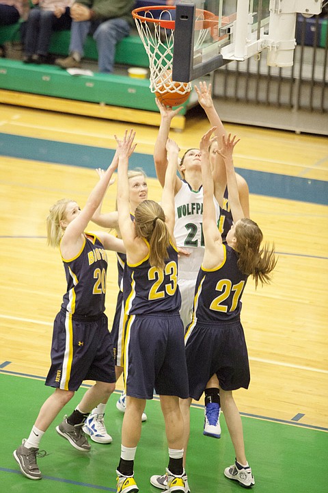 &lt;p&gt;Glacier&#146;s Cassidy Hashley (center) is surrounded by Missoula Big
Sky defenders as she goes up for a shot during Saturday&#146;s Western
AA basketball game at Glacier High School.&lt;/p&gt;