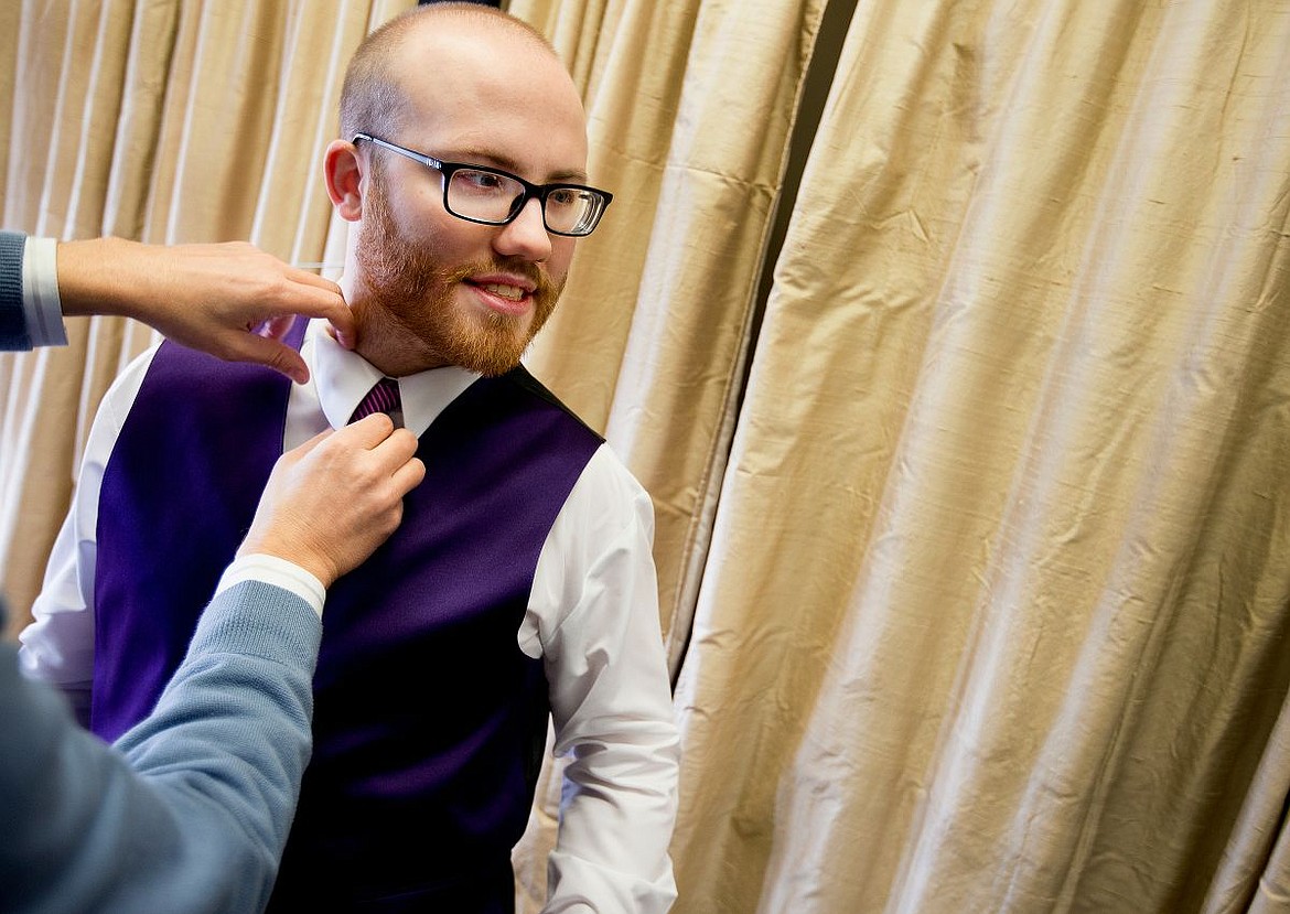 &lt;p&gt;JAKE PARRISH/Press Steven Kirsebom has his tie and collar fitted by Touchdown Tuxedo owner Steve Wasson on Friday, Feb. 5, 2016, as he prepares for the next week's Night to Shine prom.&lt;/p&gt;