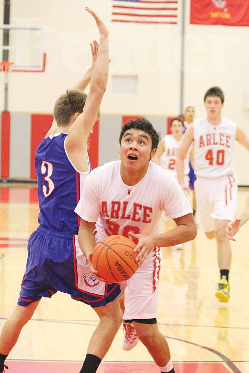 <p>Patrick BigSam battles through traffic to drop in a layup for two of his 20 points against Mission on Saturday.</p>