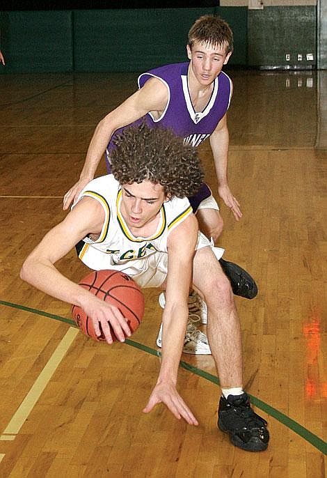 Photos by Nick Ianniello&lt;br&gt;St. Regis Tiger Pat Quinlivan dives for the ball during the second quarter of their game against the Charlo Vikings. The Tigers lost to the Vikings 56-26 in their last home game of the season Saturday night.