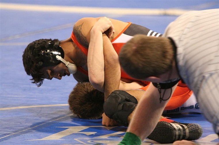 Flathead&#146;s Joaquin Calderon pins Destin Wessman of Great Falls High in the 130-pound weight class. Calderon won both of his matches on Friday and will face Dylan Mendenhall of Great Falls High in today&#146;s semifinal.