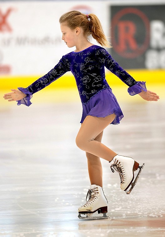 Claire Schmidt, 8, of Hungry Horse tests in the Moves in the Field competition on Friday at the Stumptown Ice Den in Whitefish. The local figure skating competition continues today from 9 a.m. until 5:30 p.m.